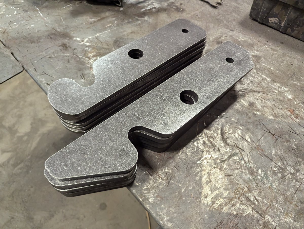 Two styles of dumpster latches