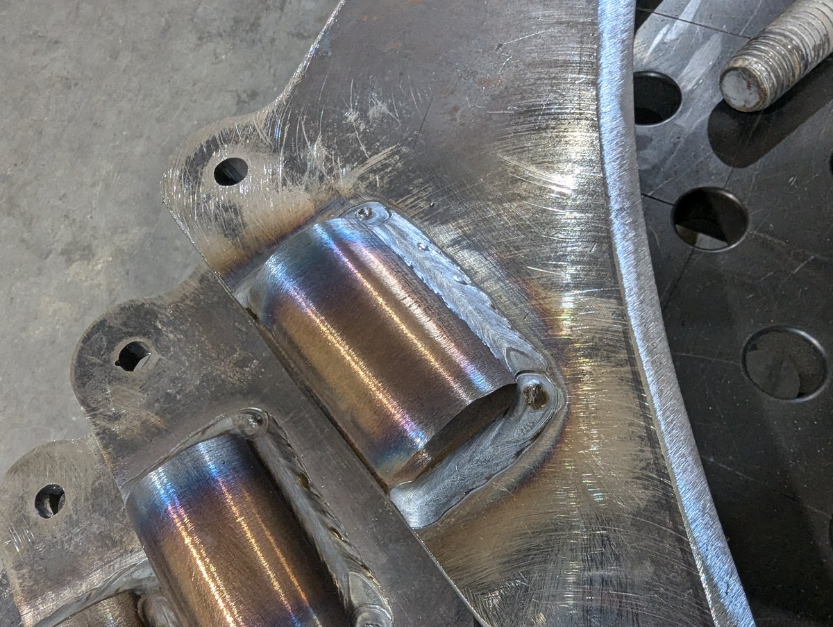 Up-close picture of two furrow cylinders welded in place in the "wizard's foot".