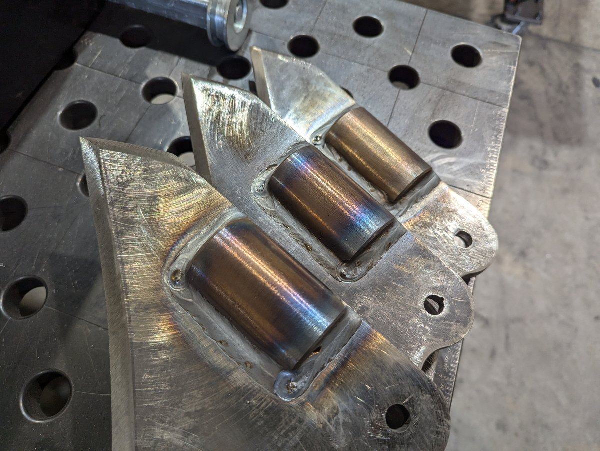 Three fully welded furrow cylinders seated within the "wizard's foot" base of three Case IH Dirt vibratory plow blades.