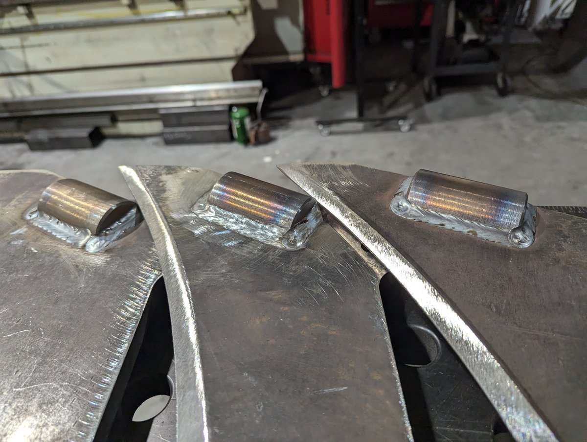 Three "wizard's foot" features at the base of the vibratory plow blades.