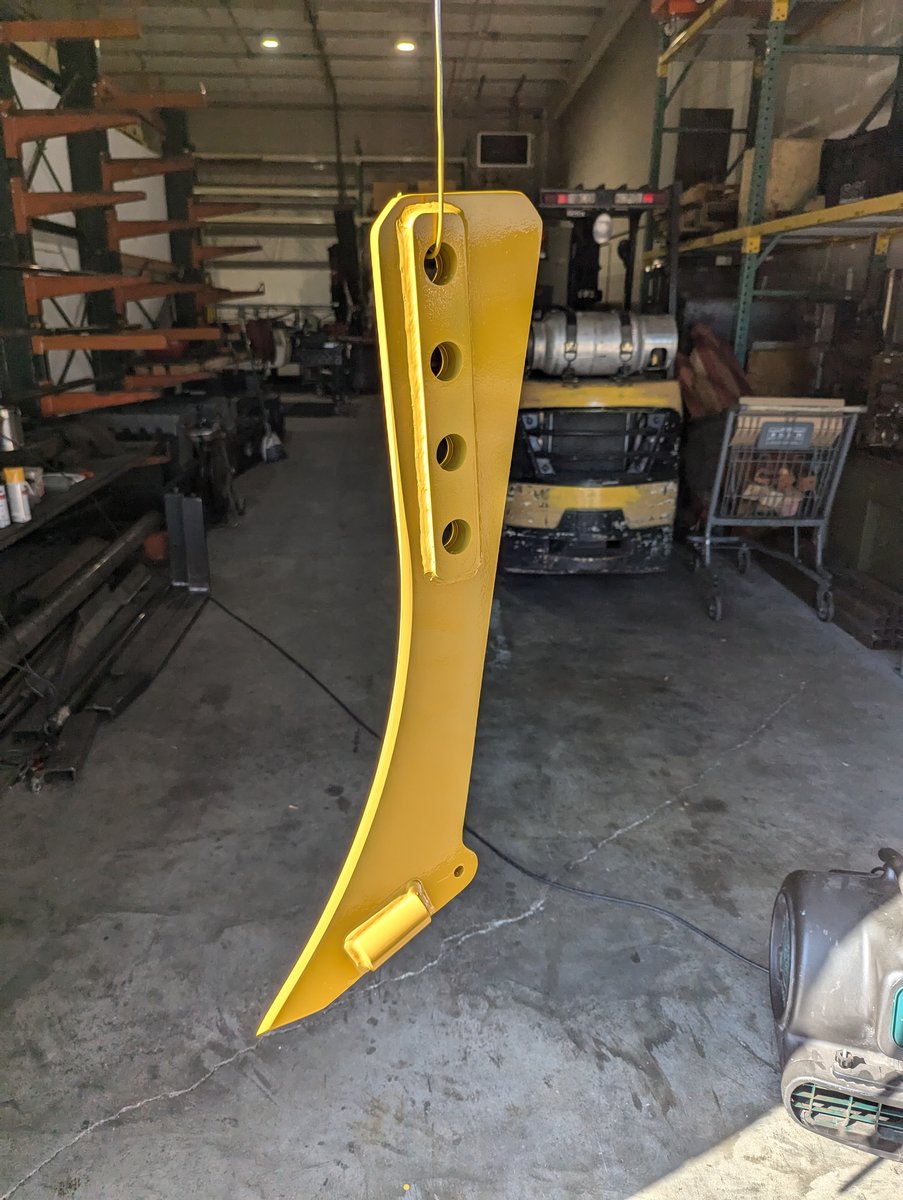 One Case IH Dirt vibratory plow blade painted yellow.